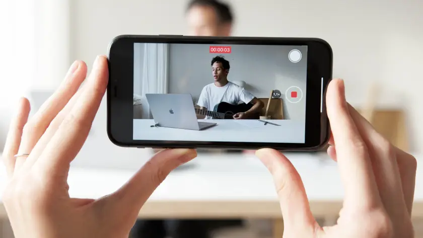Person reviewing social media content on a phone